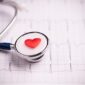 Stethoscope placed on a heart, symbolizing heart health and medical evaluation